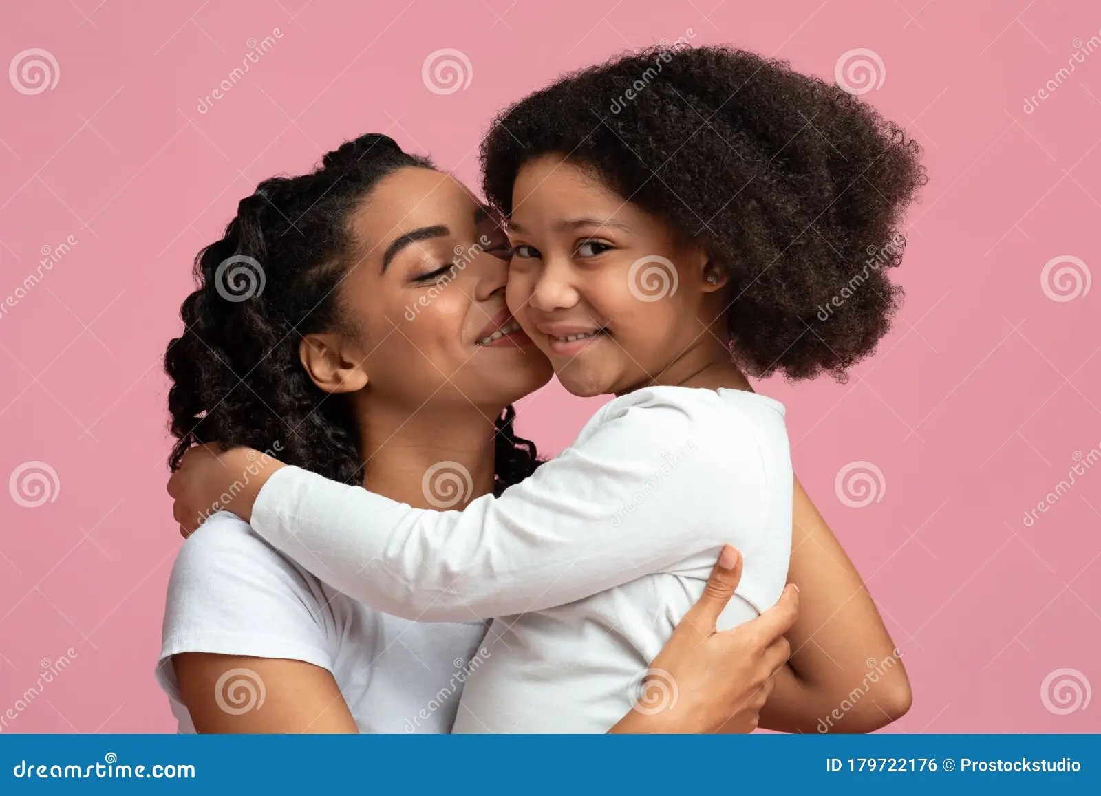 Mother`s Warmth. Loving African Woman Tenderly Kissing Her Cute Little